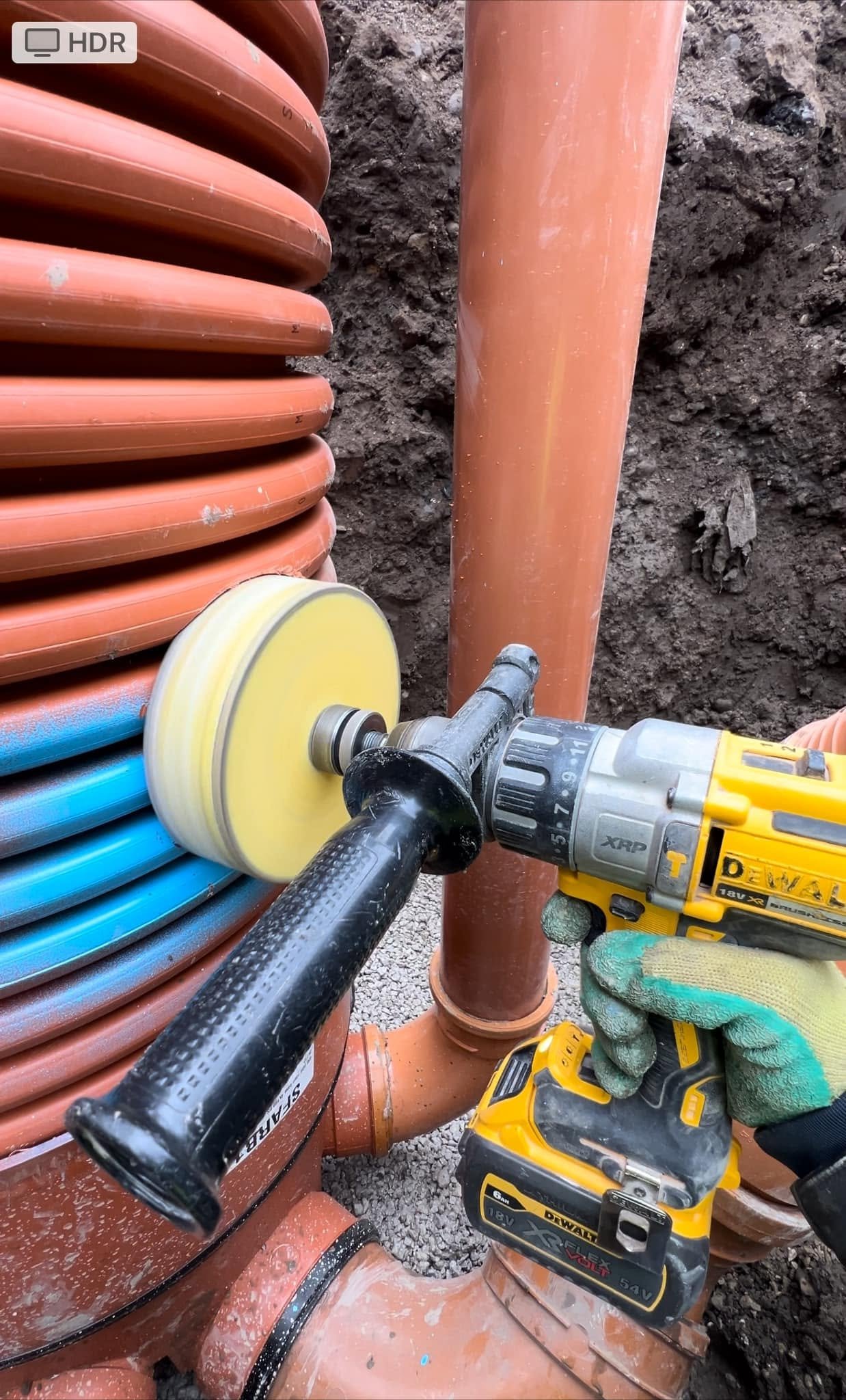 Close-up of drainage pipe installation work